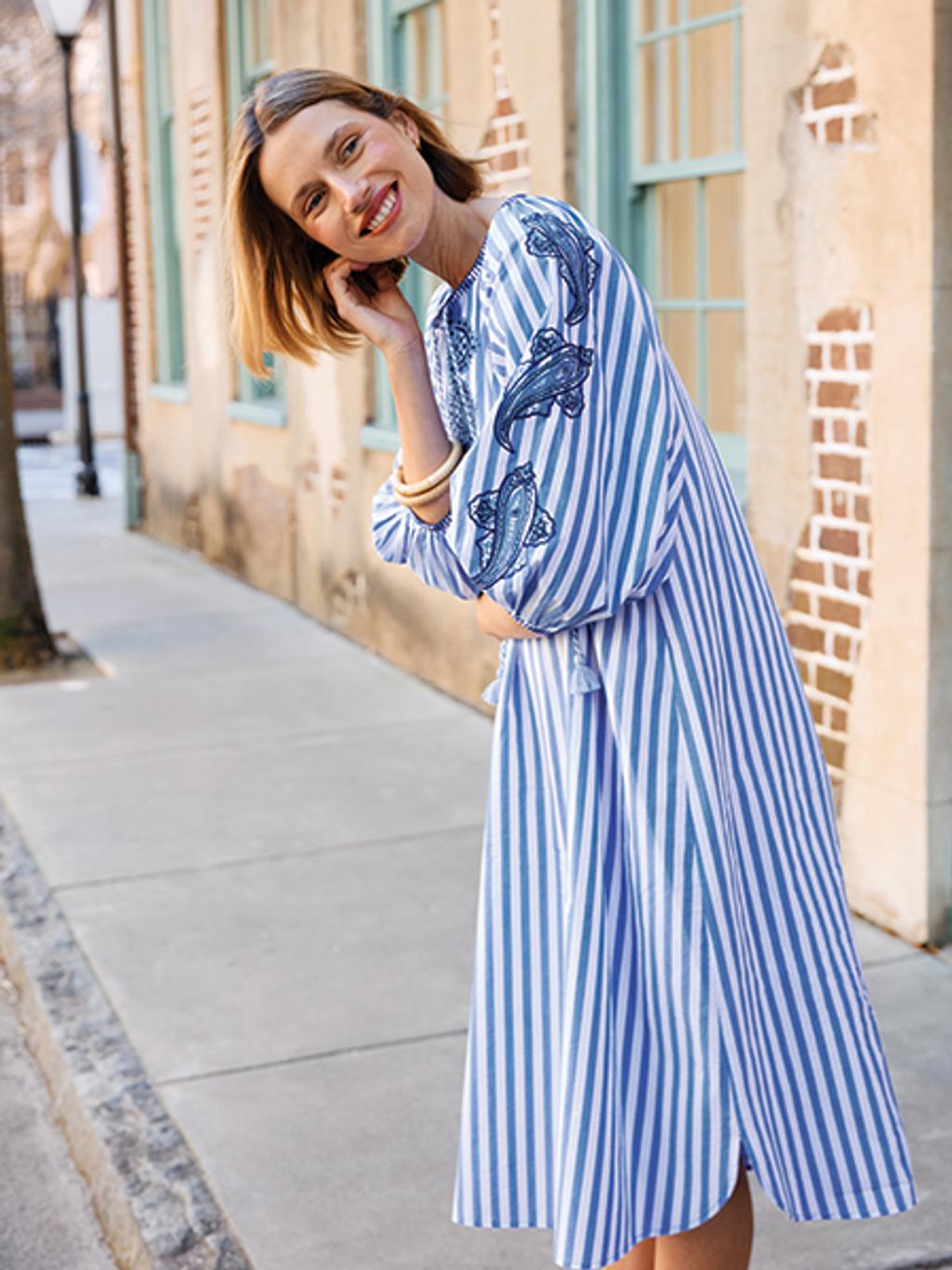 Model in striped dress with paisley embroidery