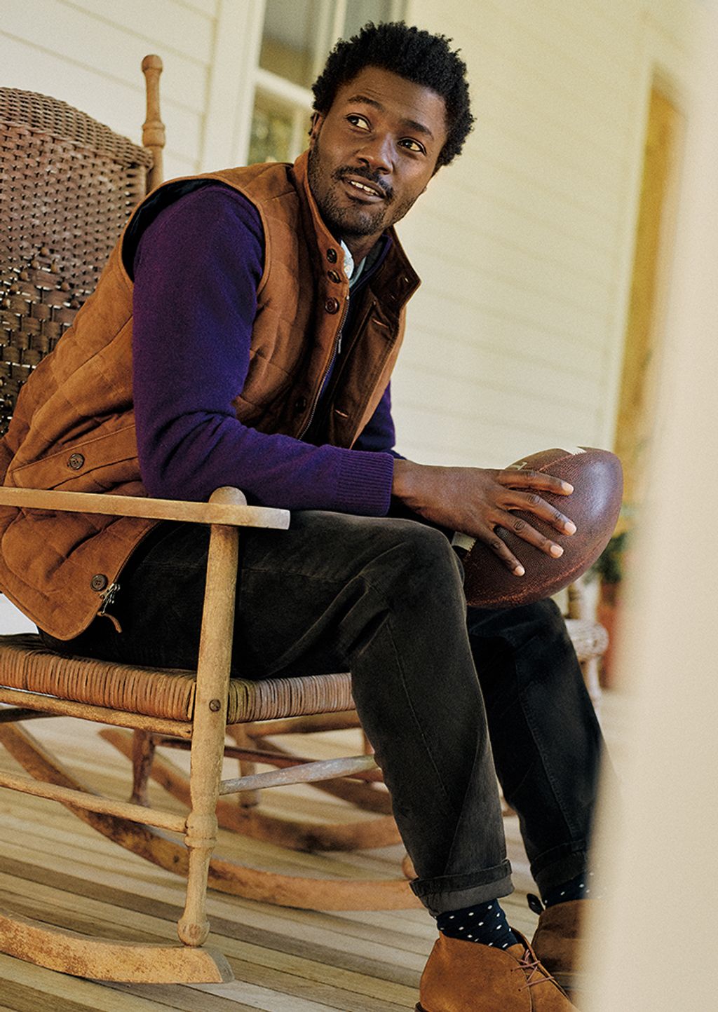 Male model wearing brown suede vest