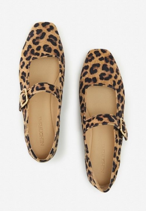 womens leopard calf hair mary jane flats on white studio background