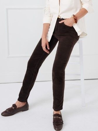 woman seated on stool wearing dark brown chocolate velveteen 5 pocket jeans