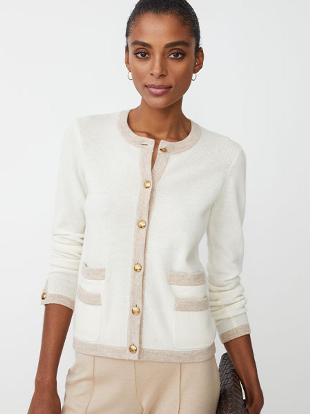 Model in ivory cashmere cardigan and beige pants Model in ivory cashmere cardigan and beige pants