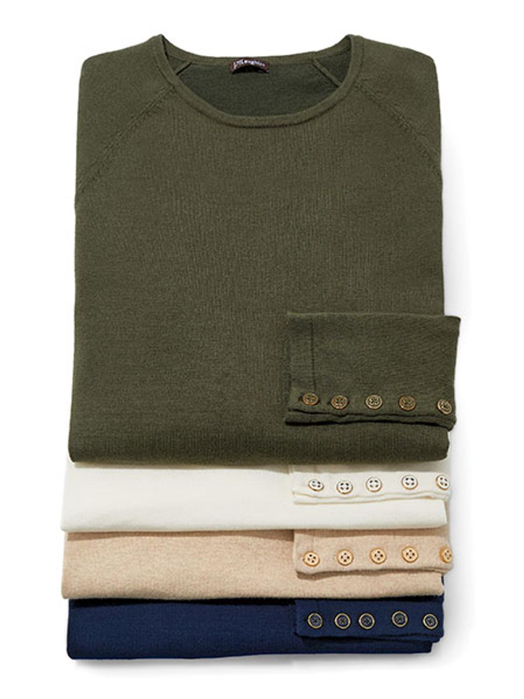Stack of cotton crewneck sweaters in olive, off white, beige, and navy