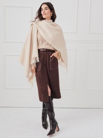 woman wearing brown suede pencil skirt with tan cashmere turtleneck and tan wrap