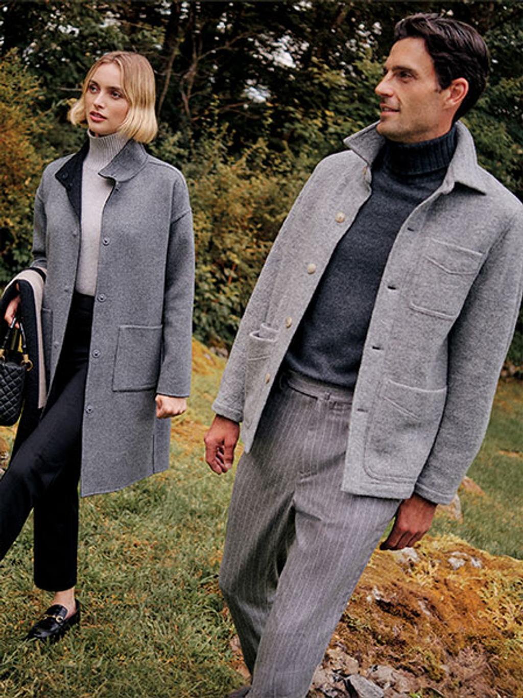 Model wearing burgundy turtleneck with leather jacket and plaid pants.