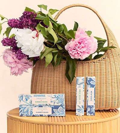 Summer Hours packaging styles with bag and flowers