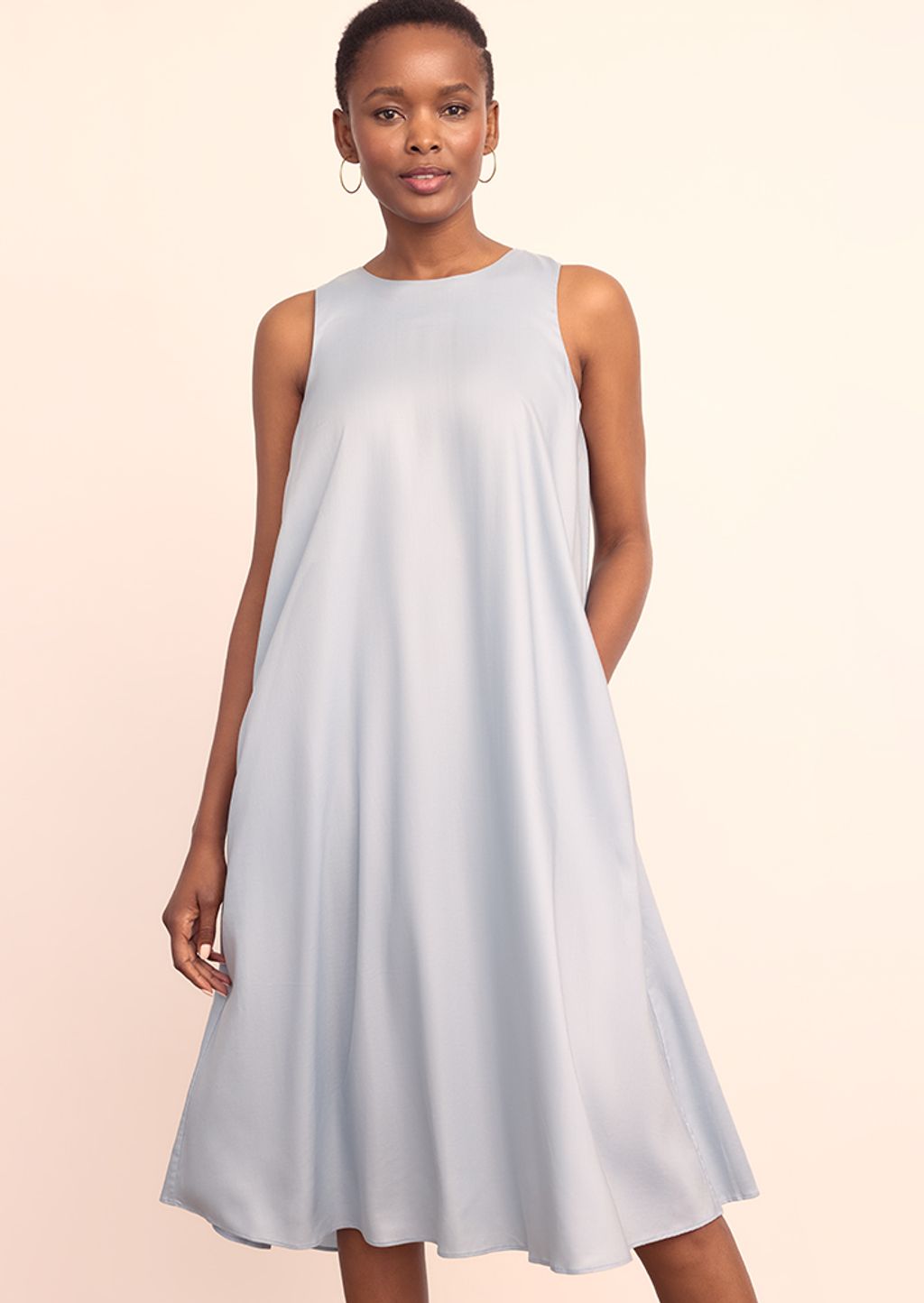 Model wearing light blue a-line dress.