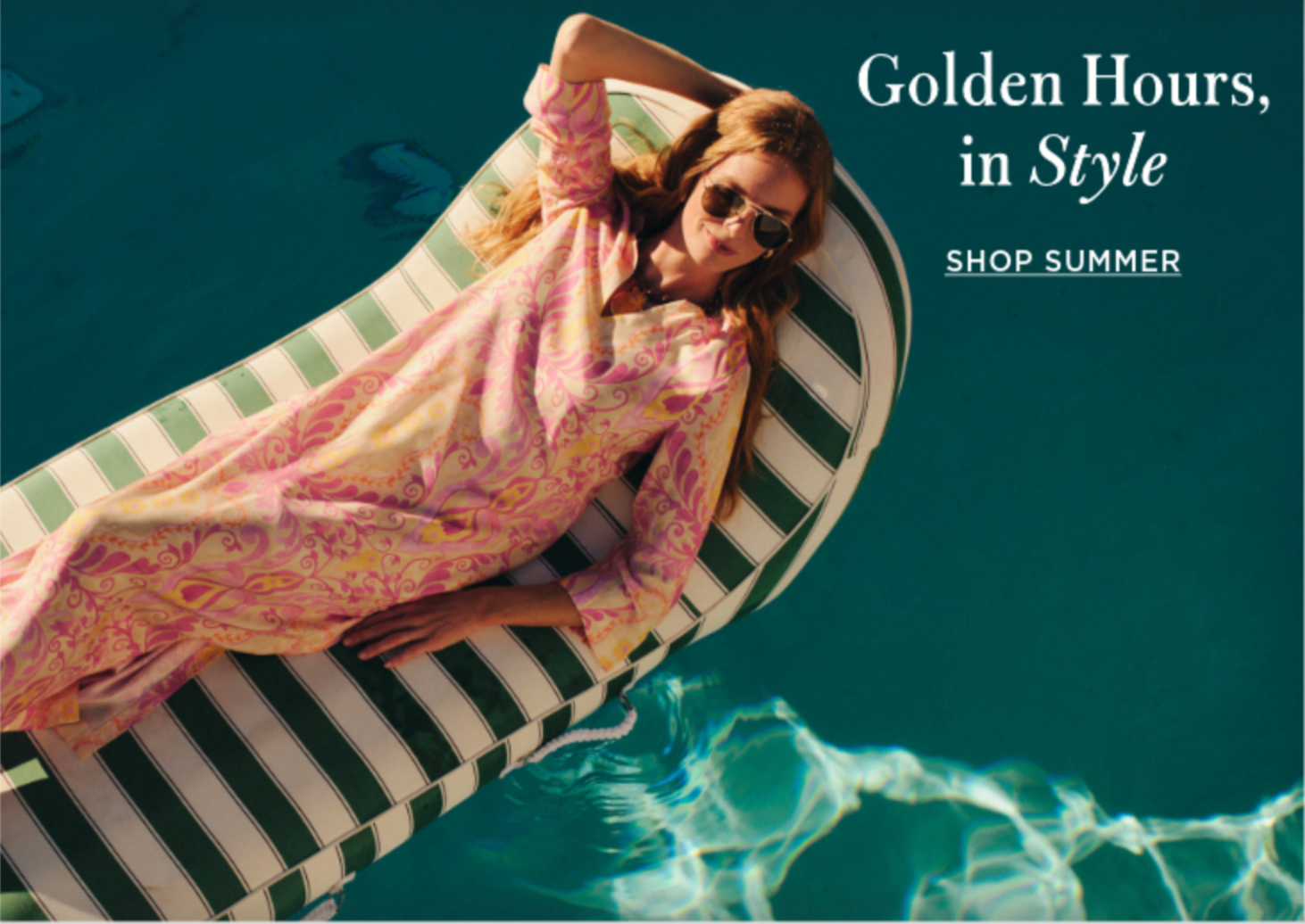 Woman in a pink patterned dress and sunglasses floats on a striped raft in a pool. Text: Golden Hours, in Style. Shop Summer.
