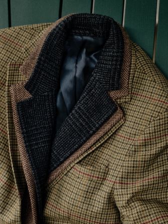 close up laydown of mens houndstooth sport coats