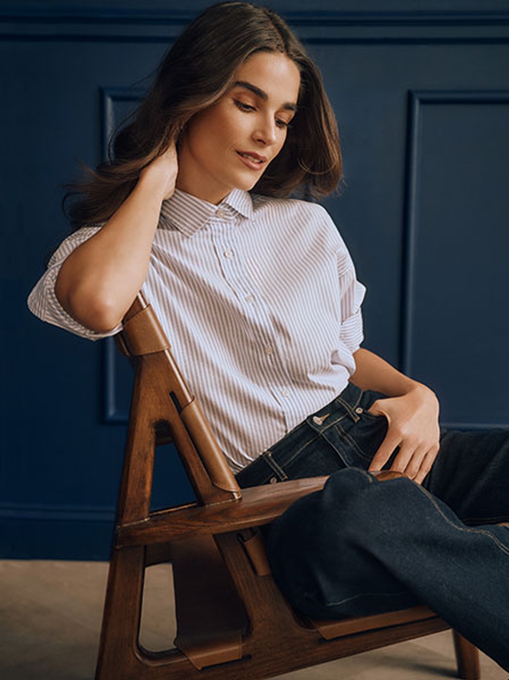 Model in striped shirt and jeans