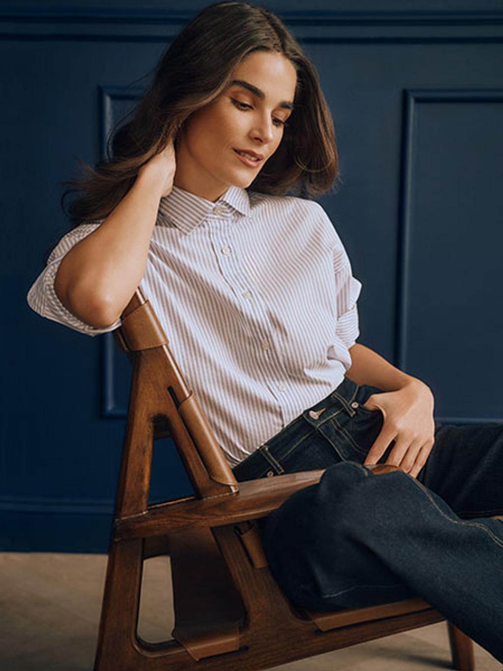Model in striped shirt and jeans Model in striped shirt and jeans