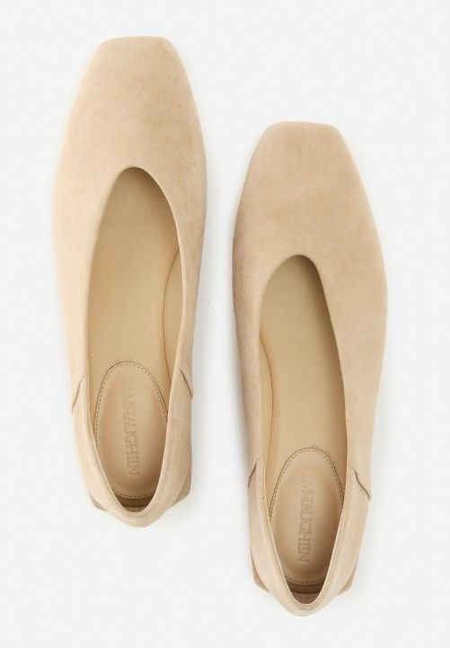 womens suede slip on flats in light tan on white studio background