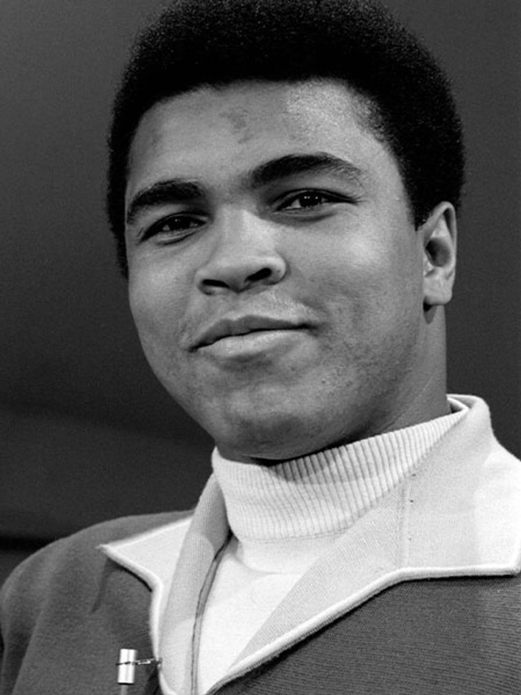 Muhammad Ali in white turtleneck