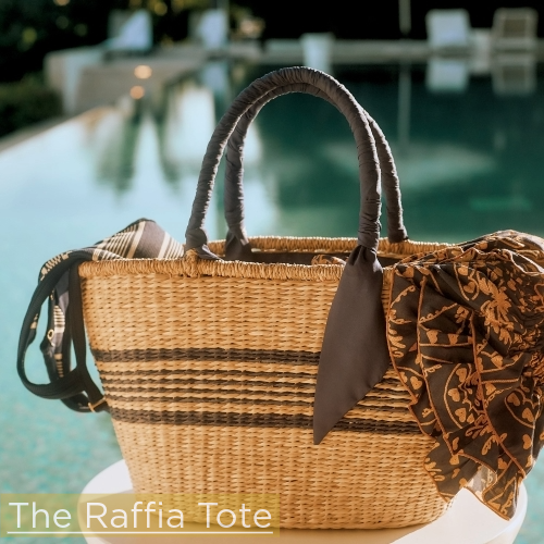 raffia straw tote positioned on pedestal in front of pool