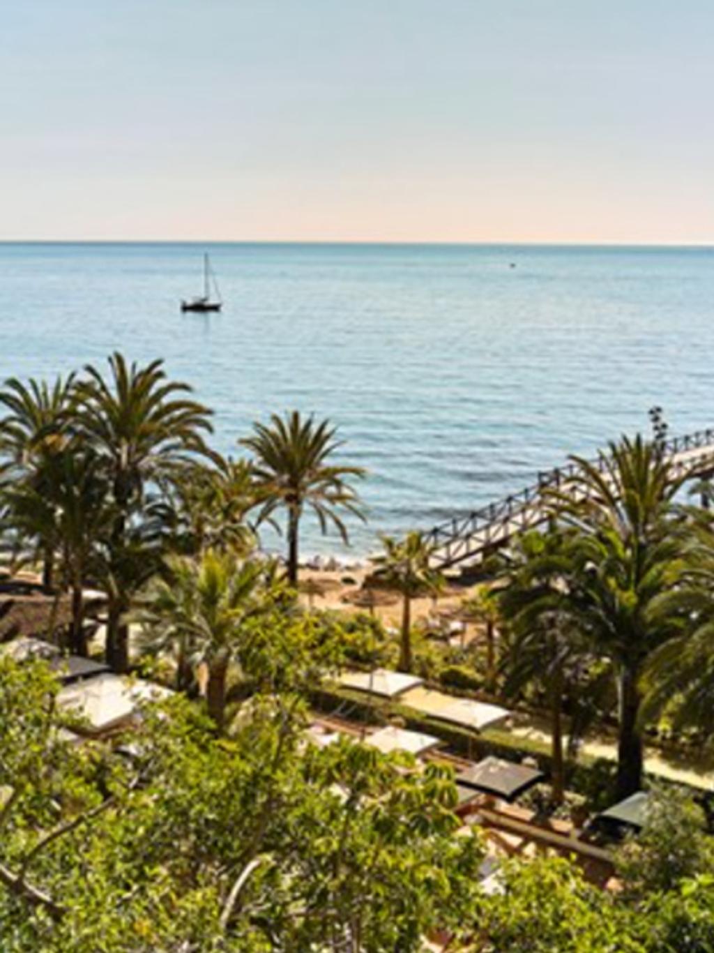 What to wear to Marbella, Spain. Think: silky maxi dresses and sunglasses.