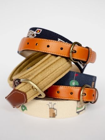 stack of mens embroidered belts