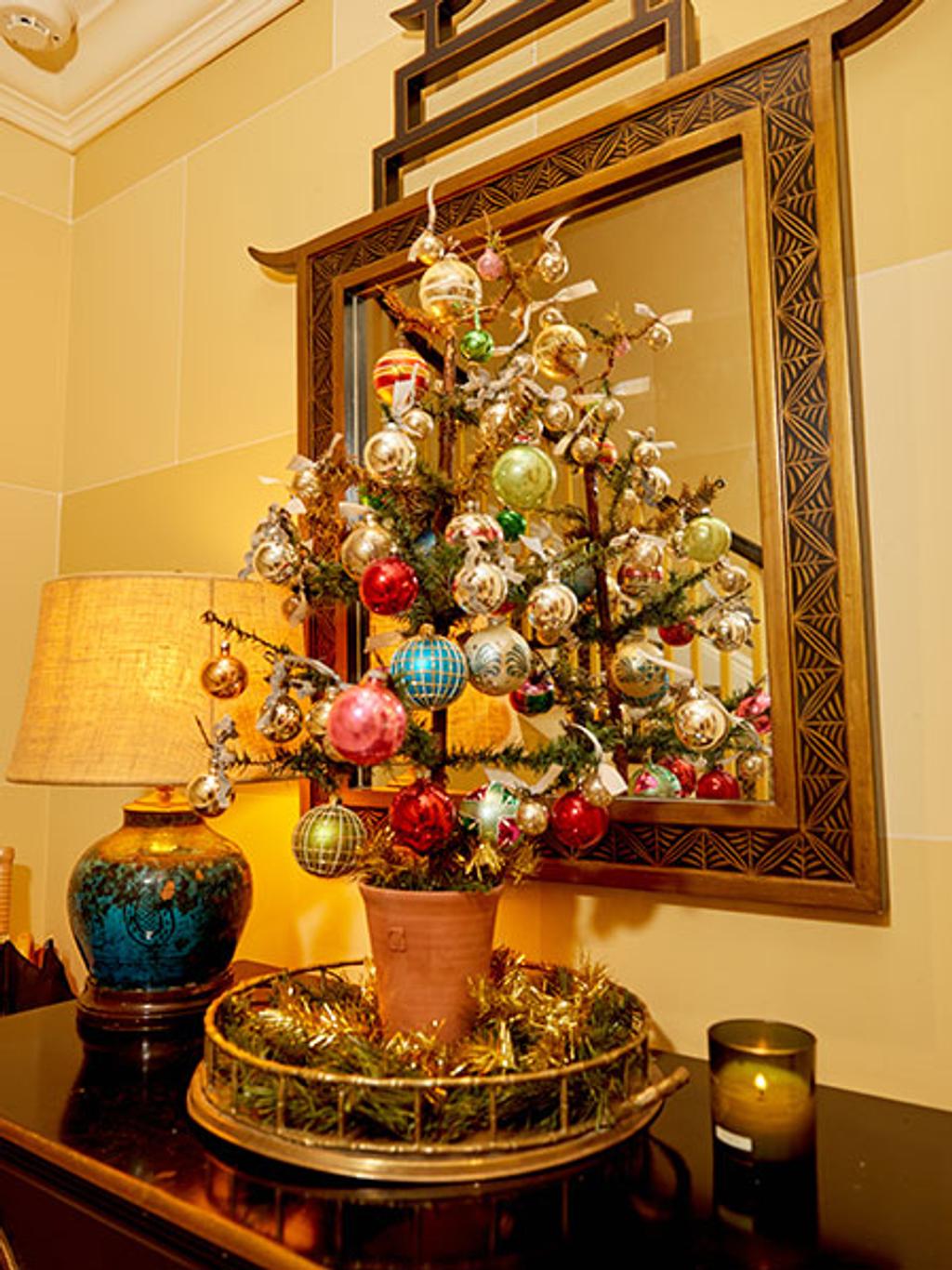 Mini Christmas tree on dresser Mini Christmas tree on dresser