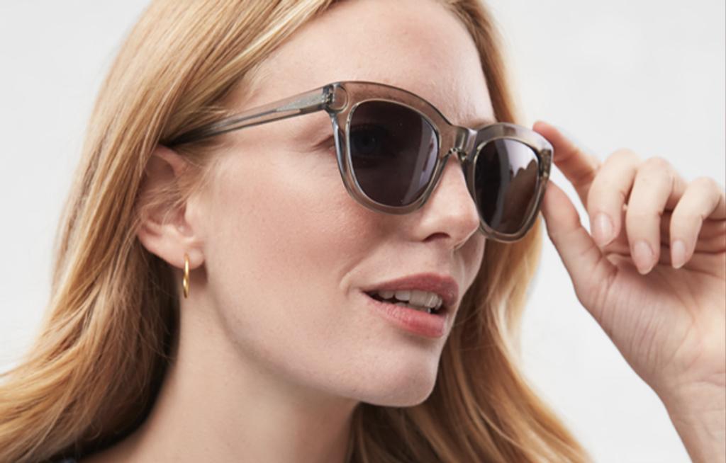 Woman wearing sunglasses.