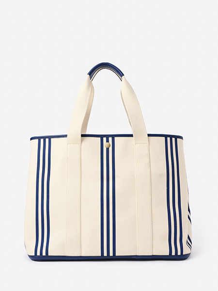 Cream canvas tote bag with navy blue vertical stripes and handles.