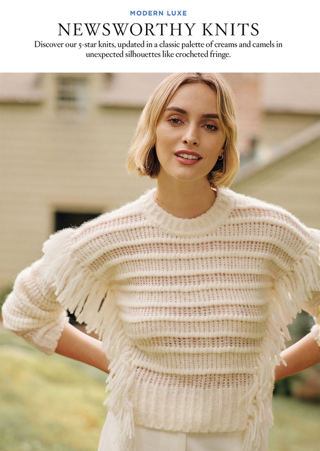 Woman in white sweater with fringe.