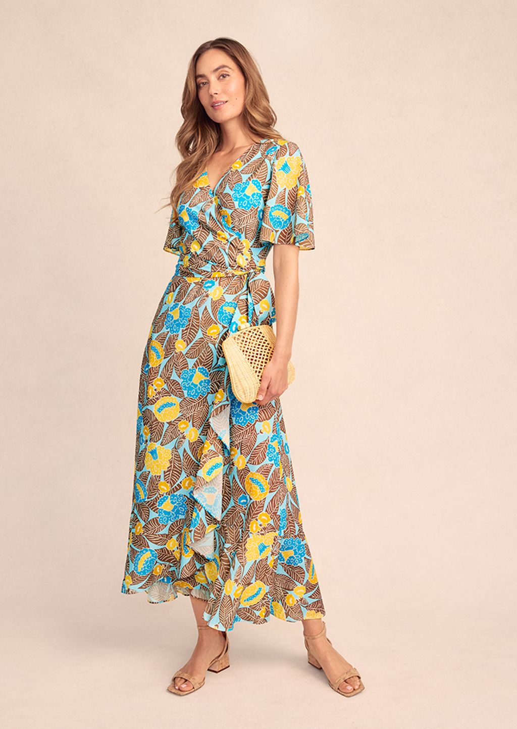 Woman in turquoise and brown dress