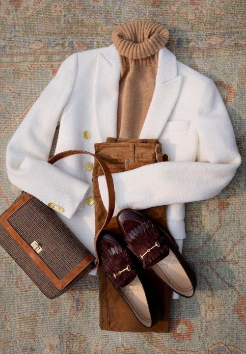 laydown of ivory boucle blazer with tan velvet jeans, brown loafers and tweed shoulder bag