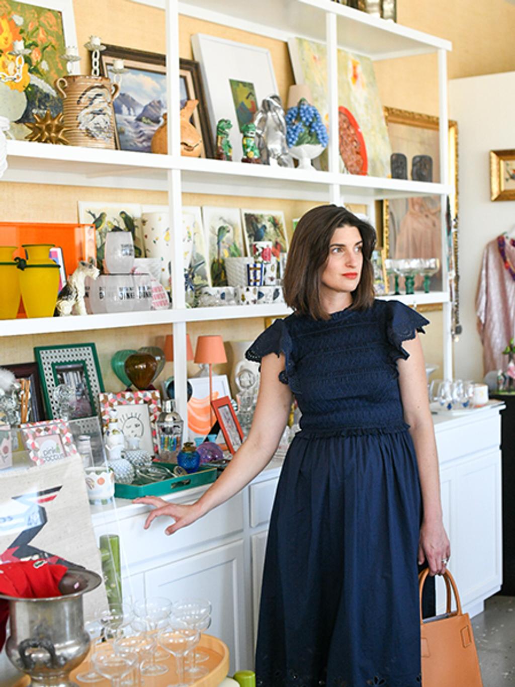 Mary & Crew wearing eyelet navy midi, woven tote, and wicker tote.