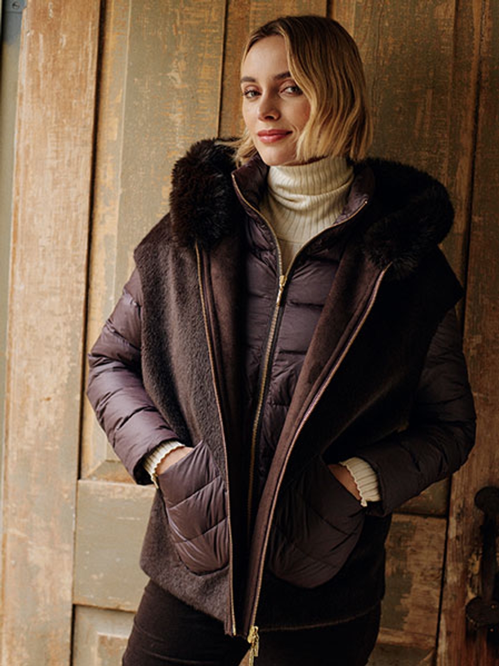 Model in brown puffer, brown velveteen jeans, and ivory turtleneck Model in brown puffer, brown velveteen jeans, and ivory turtleneck