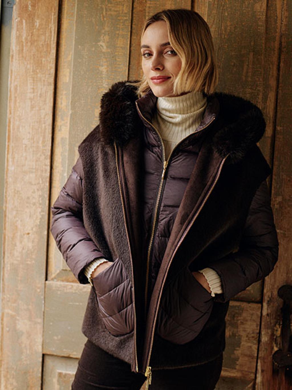 Model in brown puffer, brown velveteen jeans, and ivory turtleneck Model in brown puffer, brown velveteen jeans, and ivory turtleneck