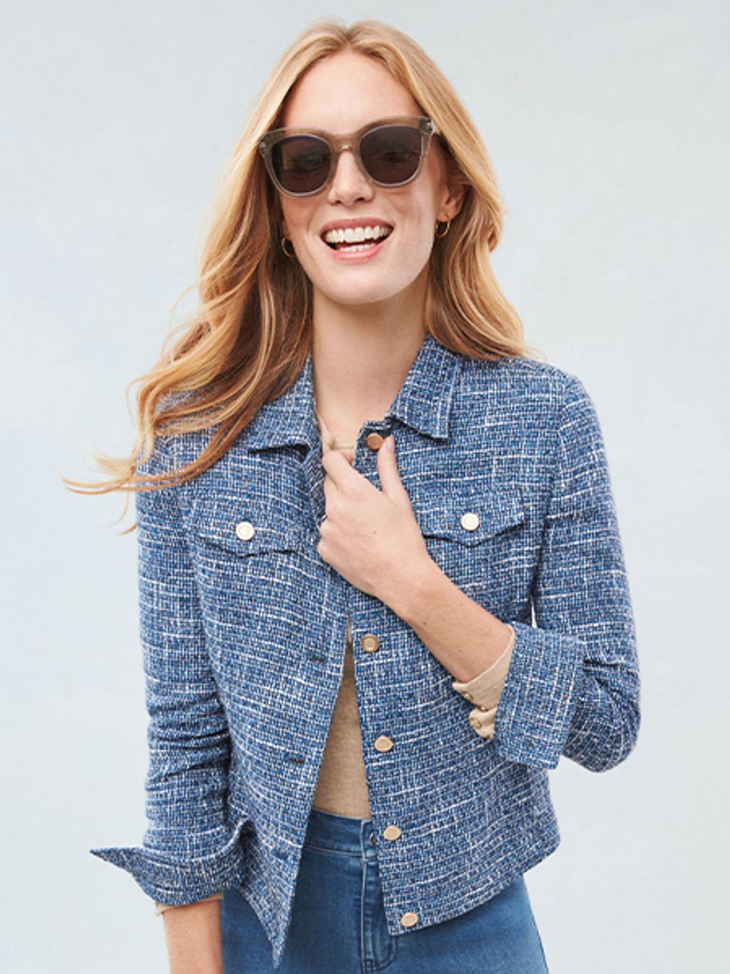 Model wearing blue tweed jacket.