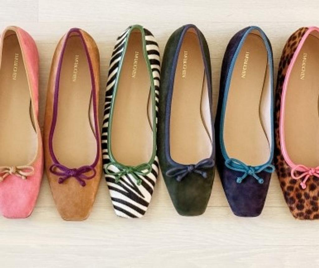Six ballet flats in a row: pink, tan, zebra print, dark green, dark blue, and leopard print.