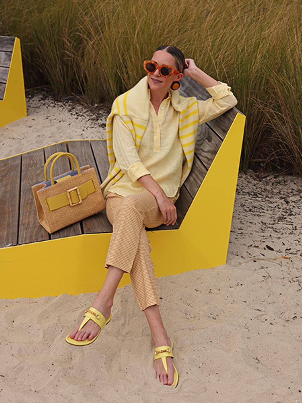 Blair Eadie in linen tunic Blair Eadie in linen tunic, gingham kick flare pants, statement wicker bag, and patent leather sandals.