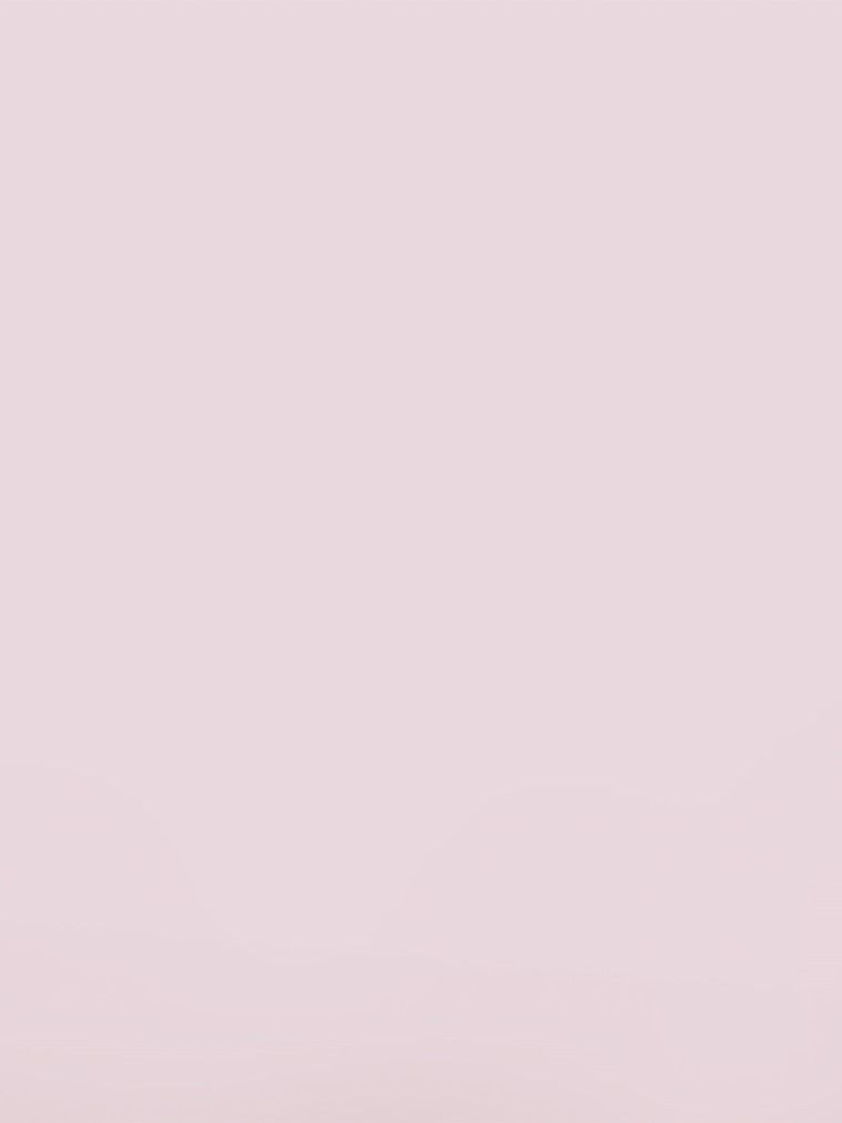 A solid pale pink background.