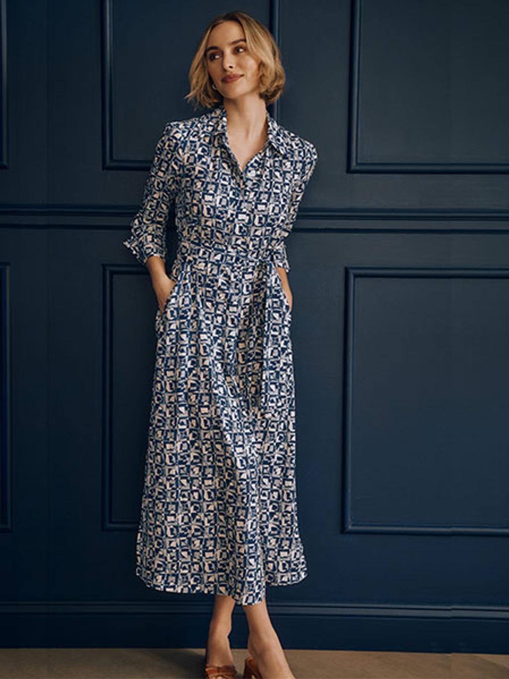 Model wearing printed shirtdress and sandals Model wearing printed shirtdress and sandals