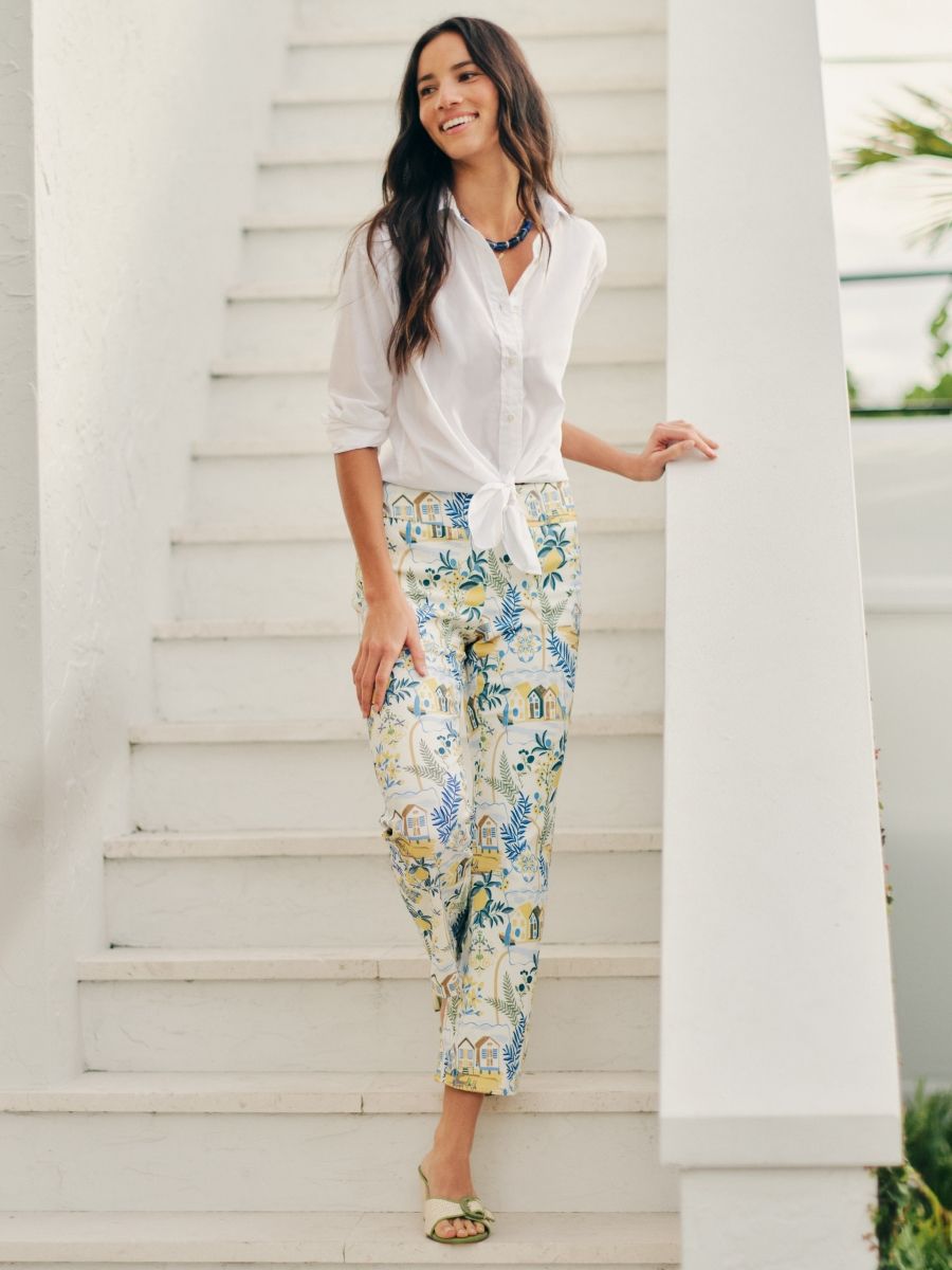 woman walking down steps in amalfi coast print pant
