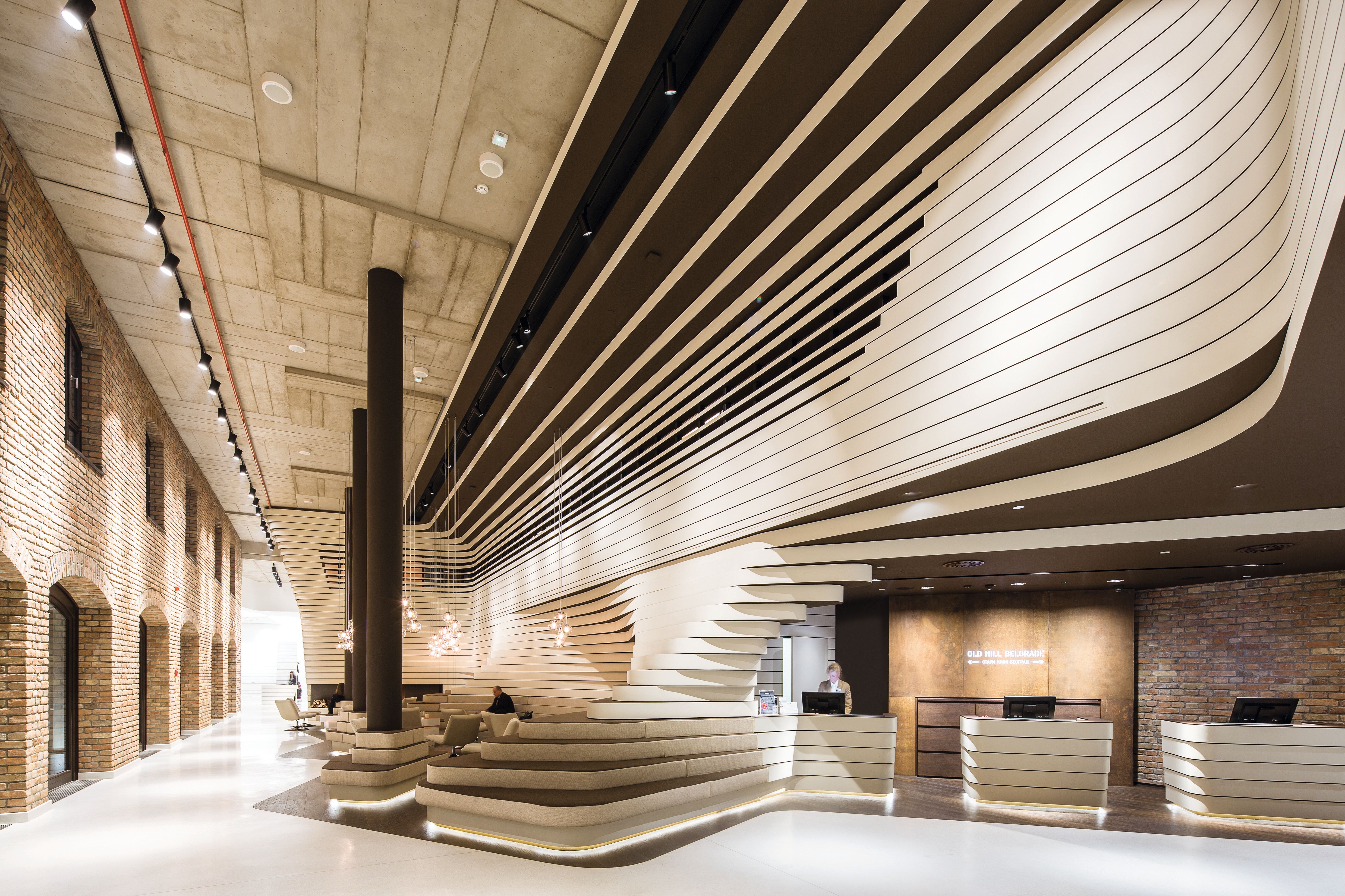 OLD MILL HOTEL BELGRADE Project type: Hotel, Adaptive Reuse Location: Belgrade, Serbia Time: 2013-2014 Client: Soravia Group/ Radisson Blu Status: Completed Photos: Tobias Hein In the white city of Old Belgrade, near the banks of the River Sava, GRAFT transformed the historic building of the “Old Mill” into a 4-star hotel. The ambitious interior concept embraces the existing historical structure and enhances it with new materials, colors and shapes, bringing out its original qualities and creating a unique visual experience.