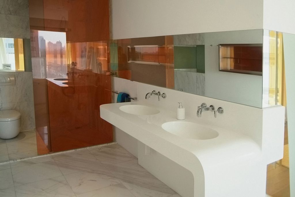 In addition to the enclosed Chinese kitchen, the apartment includes a European kitchen with bar counter open to the living area. An open, sculptural stair leads up to the private master bedroom with a terrace and library.