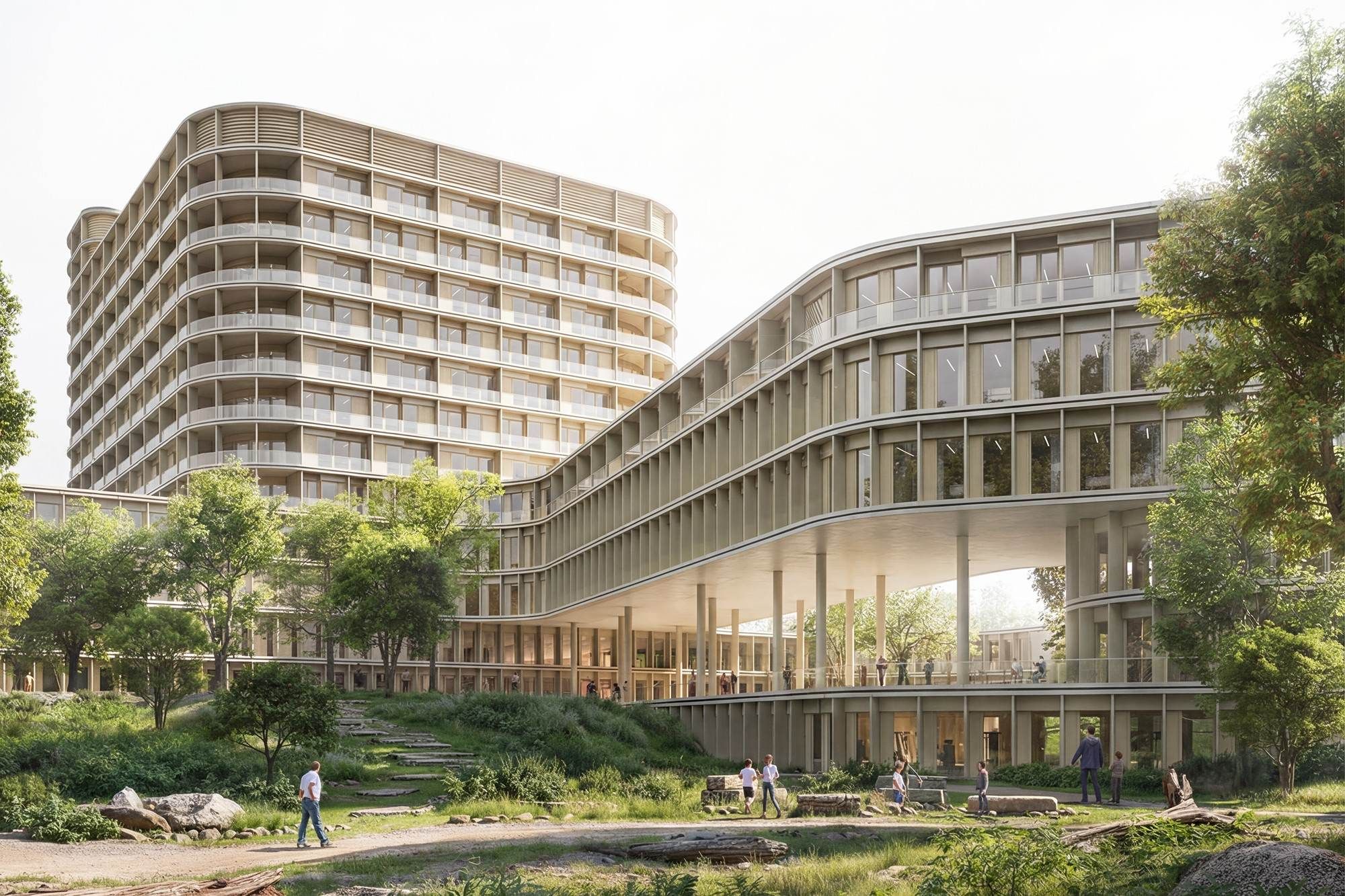 Modernes Krankenhausgebäude mit abgerundeten Ecken, eingebettet in Topographie und Landschaft
