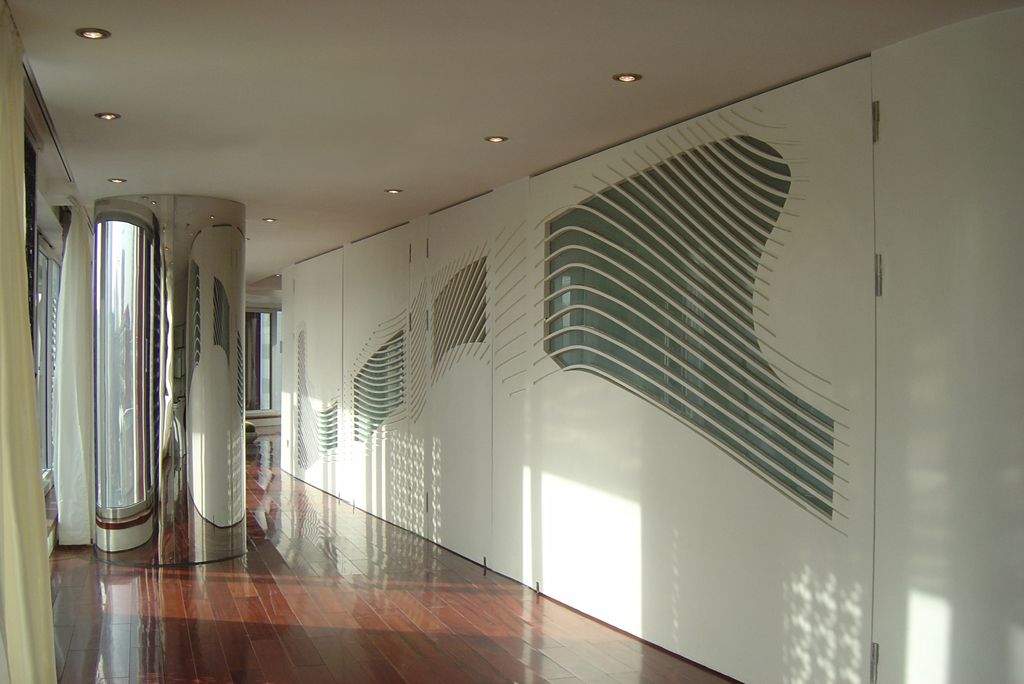 In addition to the enclosed Chinese kitchen, the apartment includes a European kitchen with bar counter open to the living area. An open, sculptural stair leads up to the private master bedroom with a terrace and library.