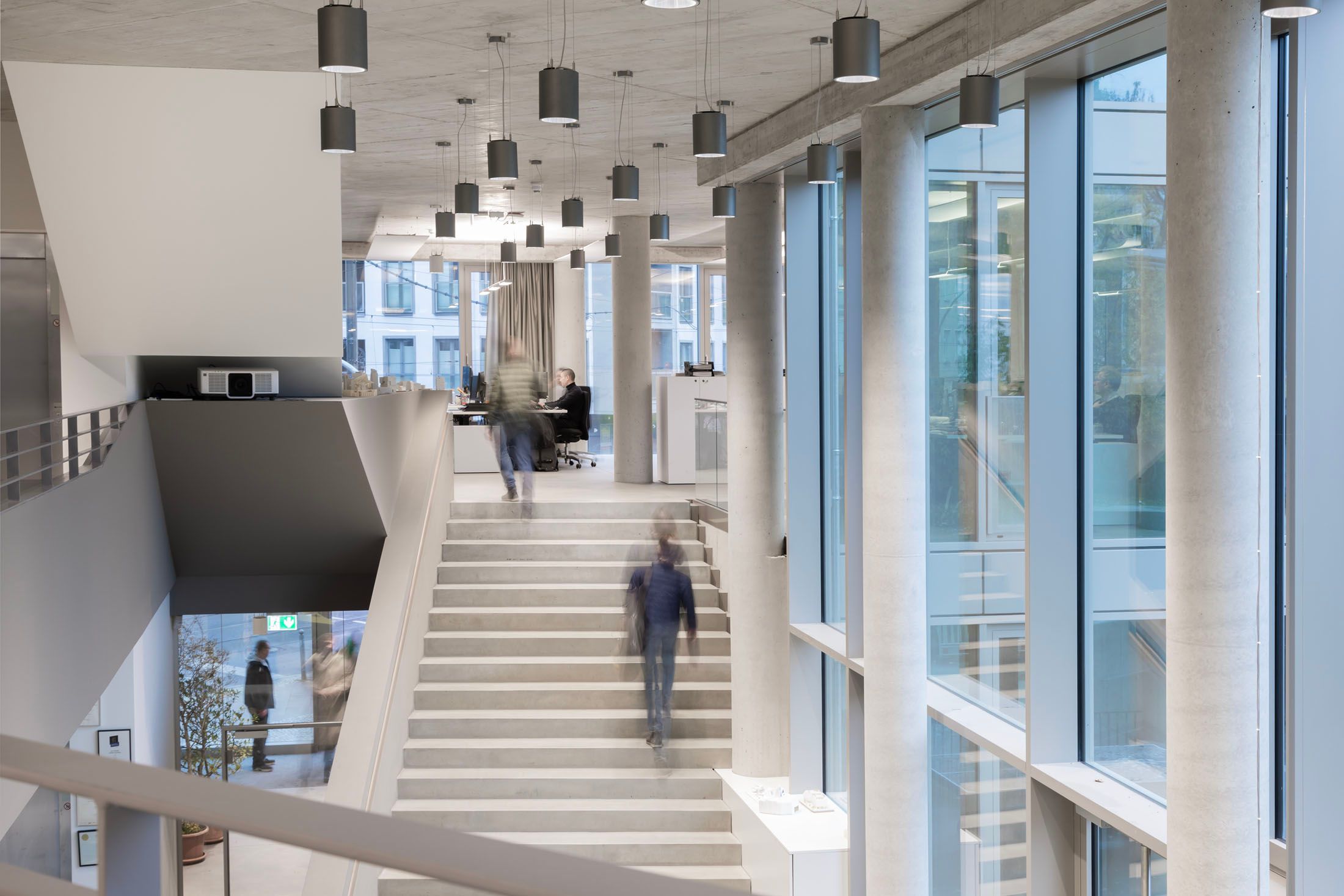 view into a modern office building with big open staircase