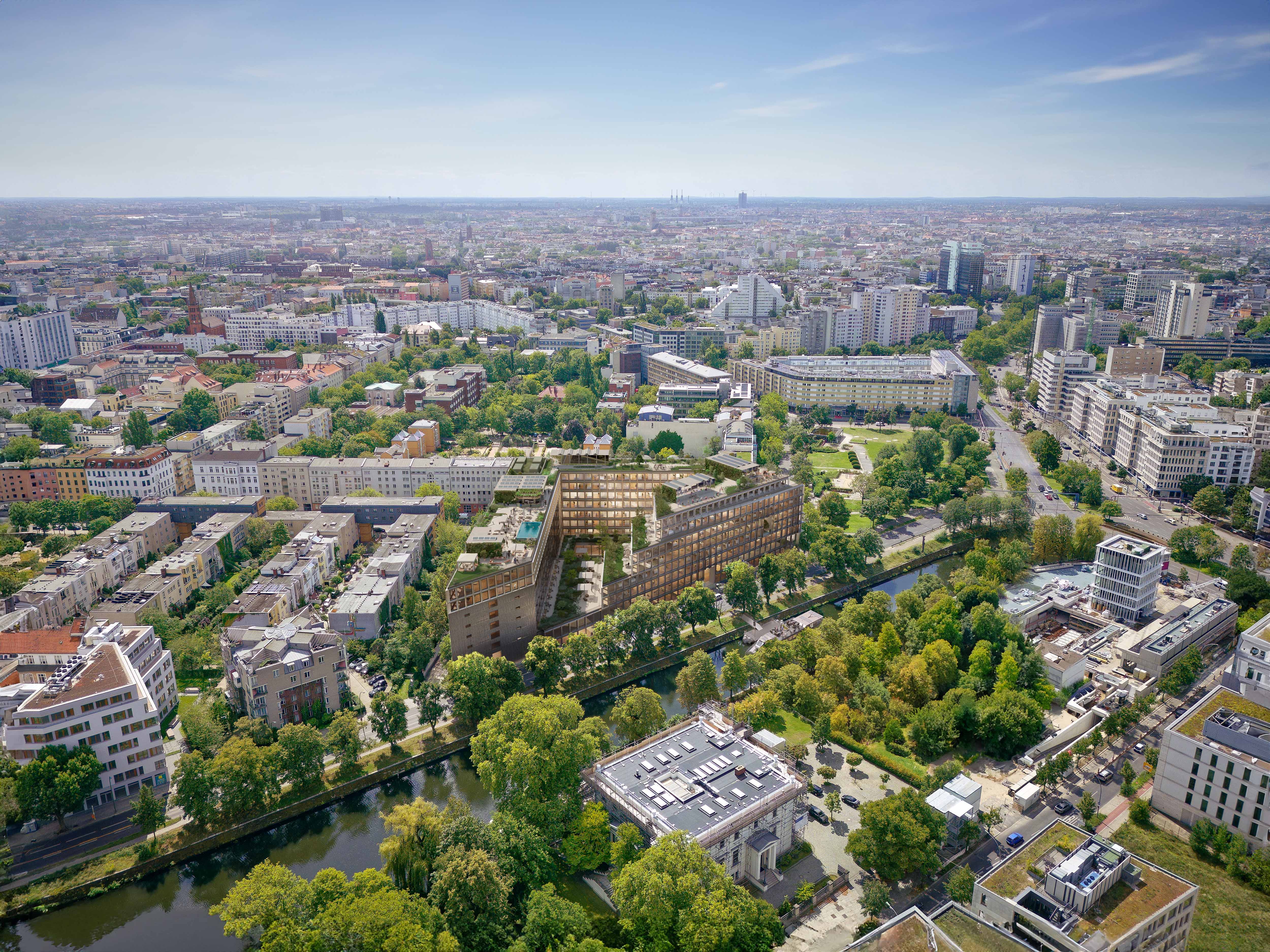 Aerial view from building complex in dense urban city context close to a canal