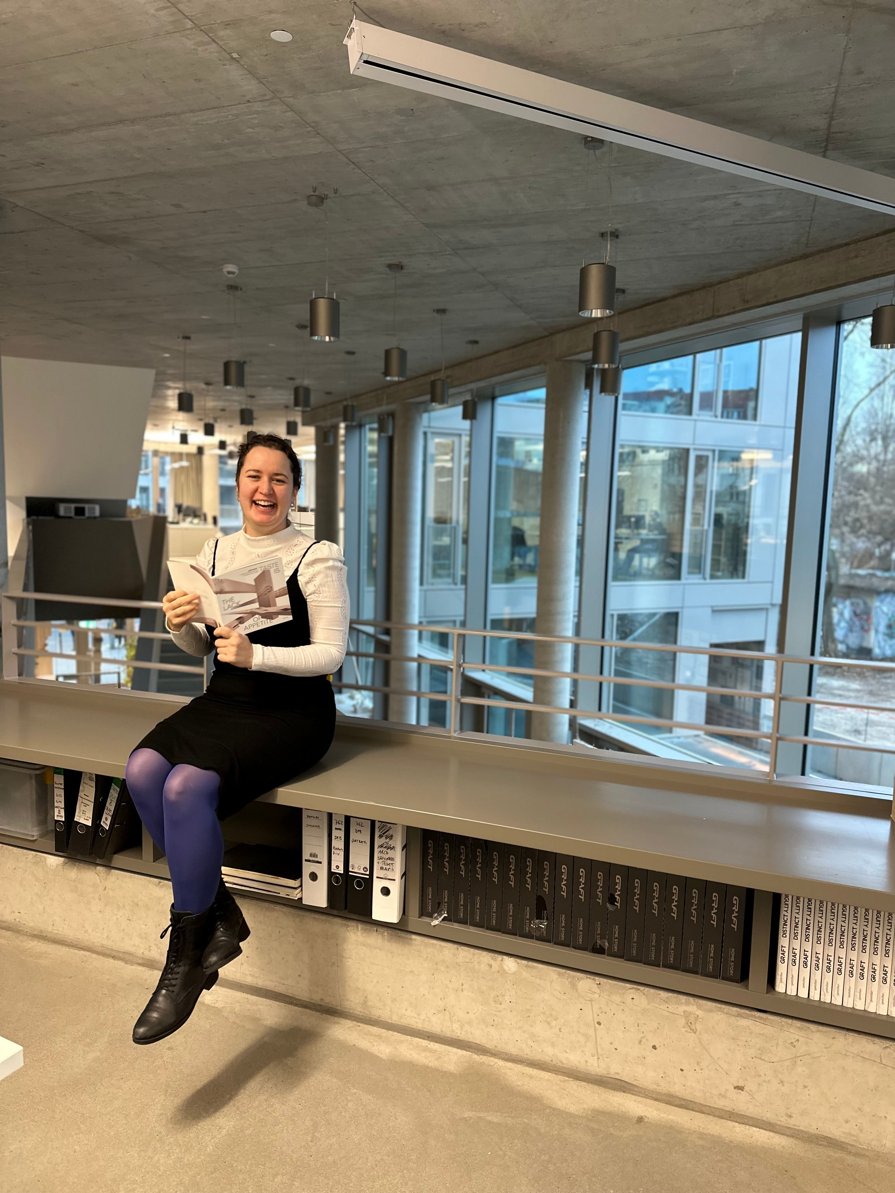 Alma with Aedes exhibition catalogue in the GRAFTLAB (c) GRAFT