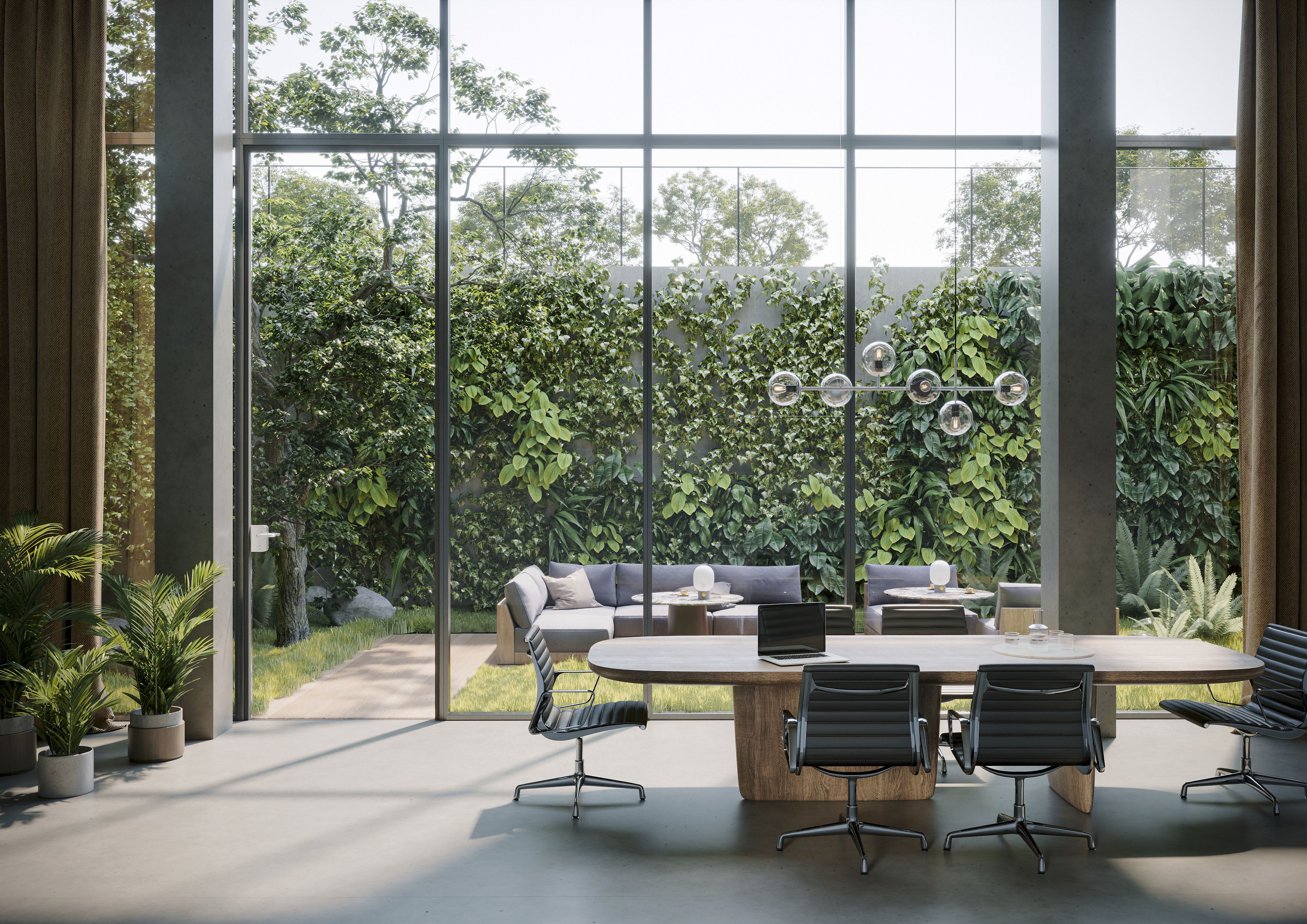 Modern office meeting room with large wooden table, black swivel chairs, and floor-to-ceiling windows overlooking a green outdoor garden wall