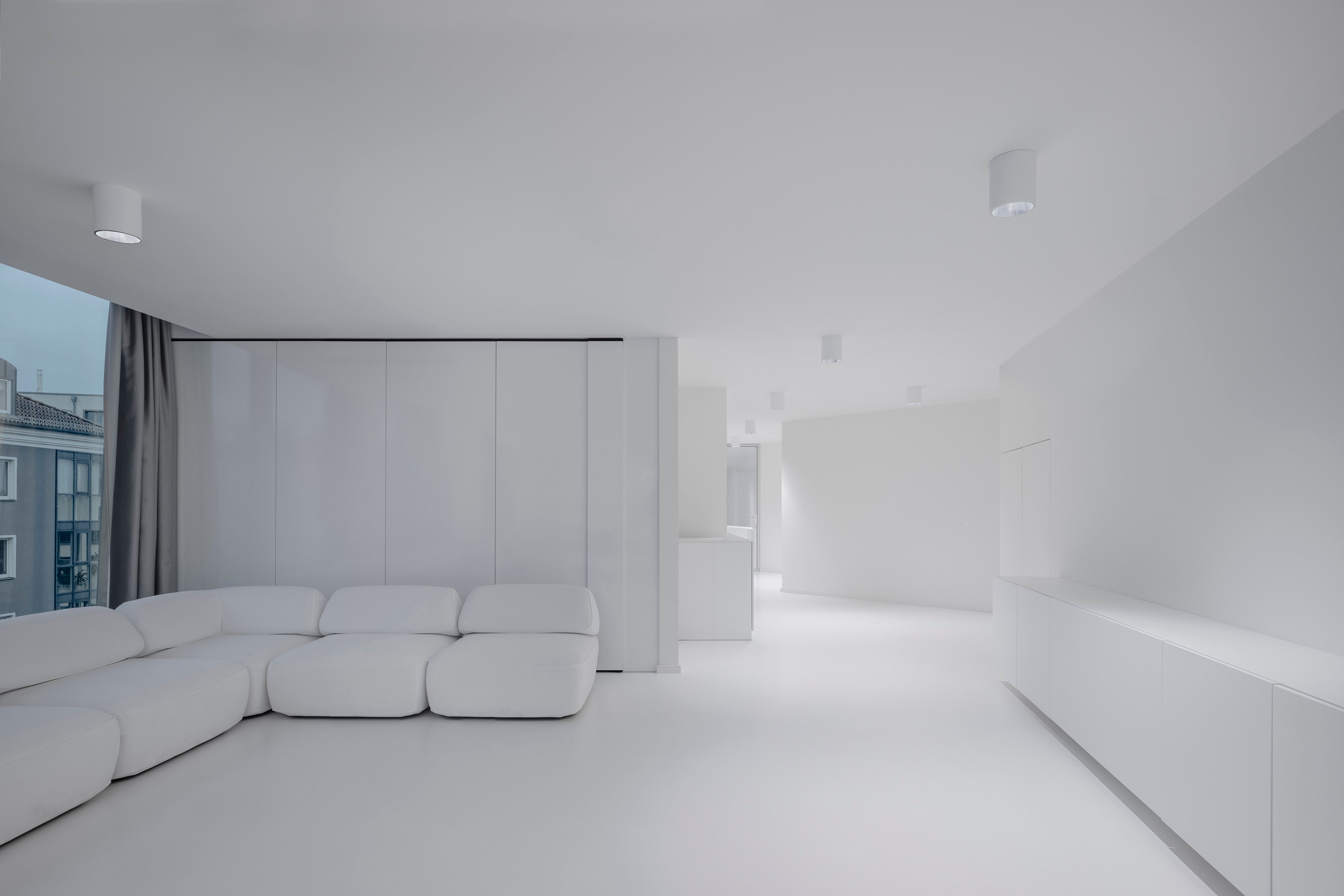 Conference area - floor, ceiling, wallls, and furniture are all in white