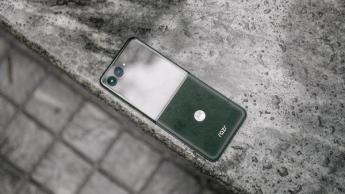 Motorola Razr Ultra 2025 on top of marble surface showing Alcantara back.
