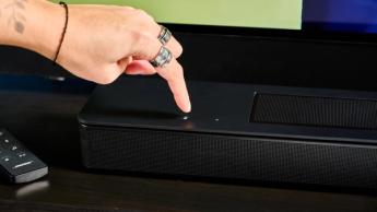 the black bose smart soundbar 2024 with remote, 2 touch controls on top, and mesh covering on top