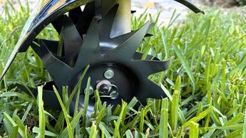 Echo TC-210 Tiller closeup view of blades in grass