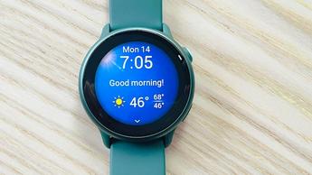 Garmin Vivoactive 6 in emerald green with the Morning Report shown on the screen