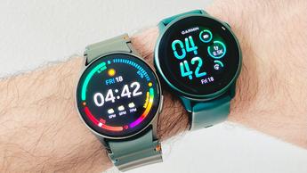Close-up of the Samsung Galaxy Watch 7 on a user's wrist next to the Garmin Vivoactive 6