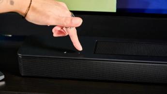 the black bose smart soundbar 2024 with remote, 2 touch controls on top, and mesh covering on top