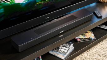 the black bose smart soundbar 2024 with remote, 2 touch controls on top, and mesh covering on top